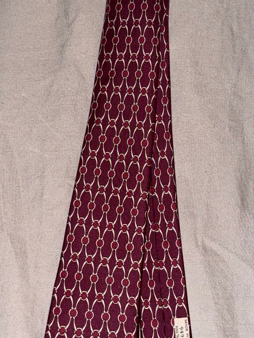 Hermes 100% Silk Tie with Linked Ring Motif in Berry